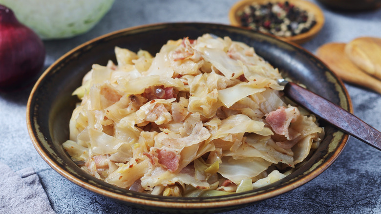 A dish of southern fried cabbage with bacon