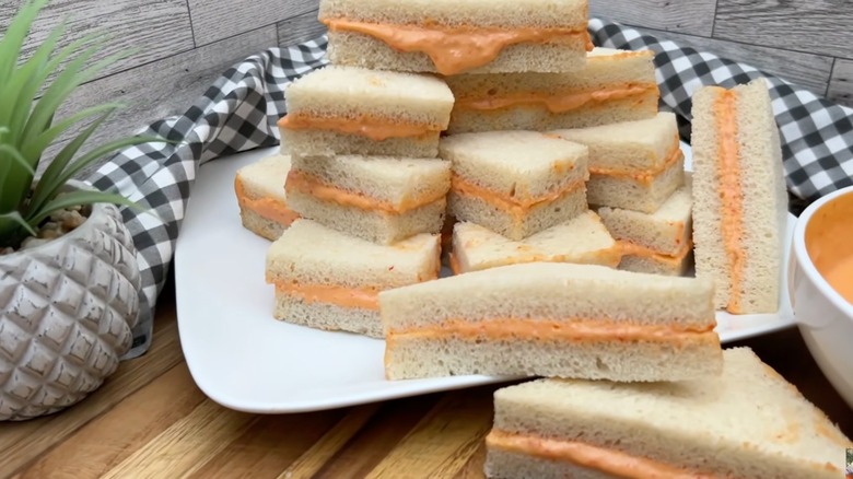 Plate stacked with sandwiches de mezcla