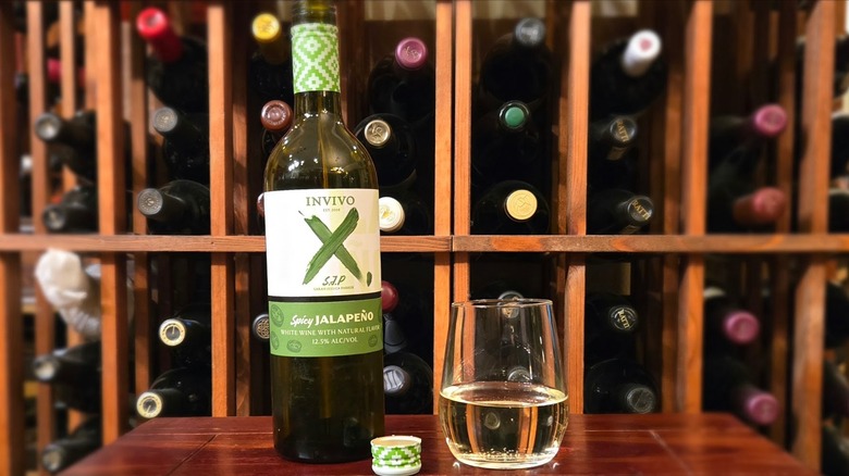Bottle of Invivo X, Sarah Jessica Parker Spicy Jalapeño White Wine with stemless glass.