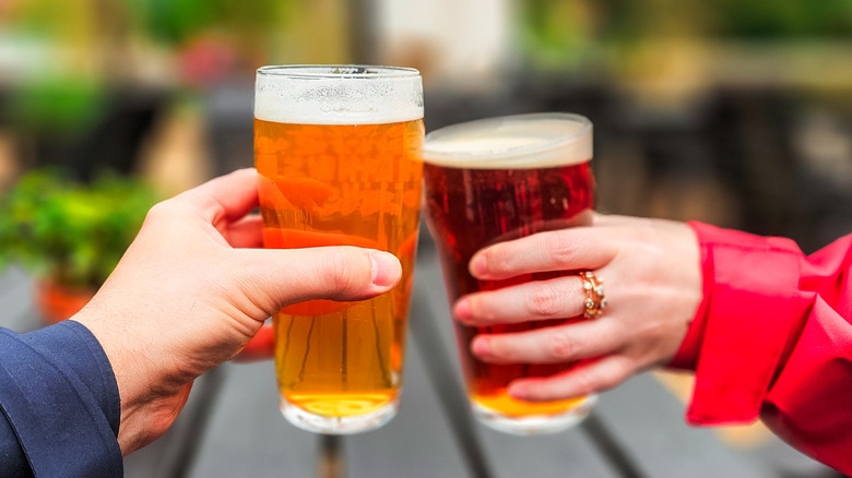 Two people drinking craft beers