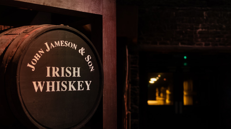 Barrel of Jameson in dark and blurred basement