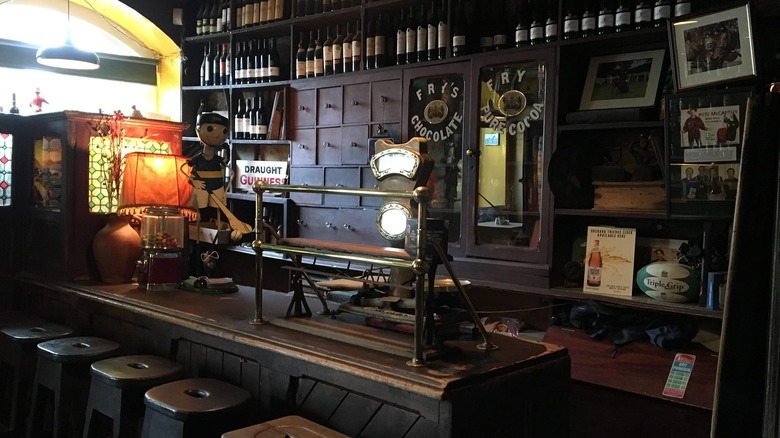 Interior of McCarthy's with bar, stools, and signage