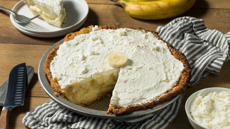 banana cream pie with slices cut