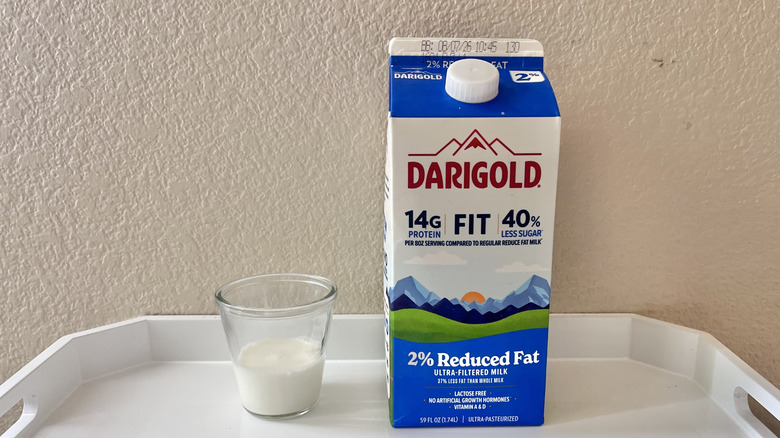Darigold 2% milk carton with a glass of milk