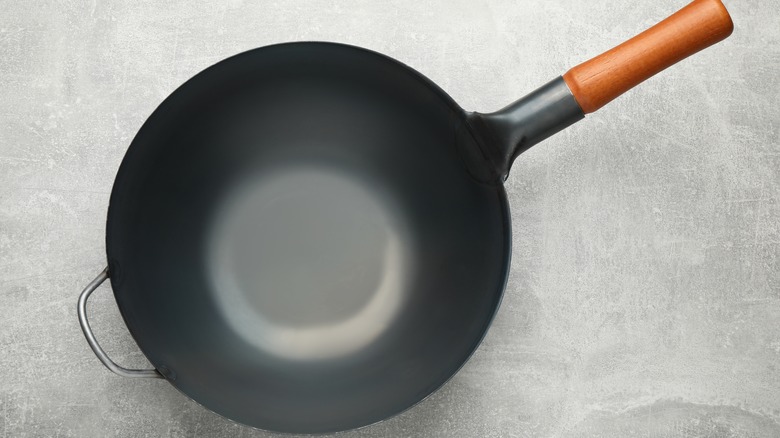 wok on gray background