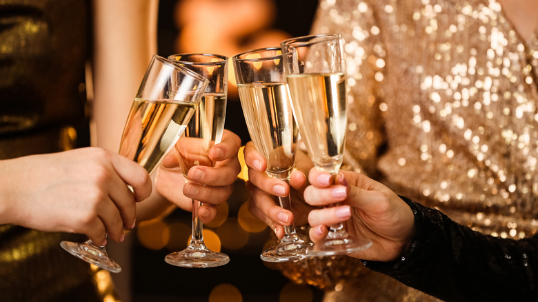 women toasting champagne glasses
