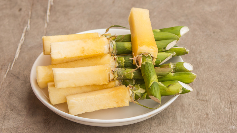 Pineapple cores sliced on a white plate