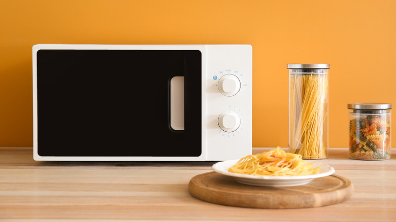 pasta plate next to microwave