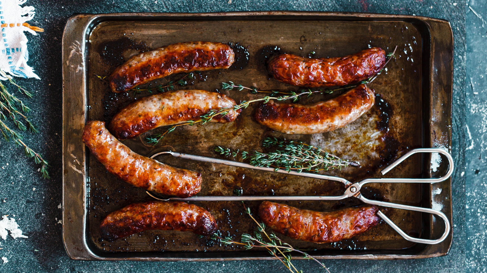 Is Oven-Baking Sausages Better Than Frying? - Tasting Table