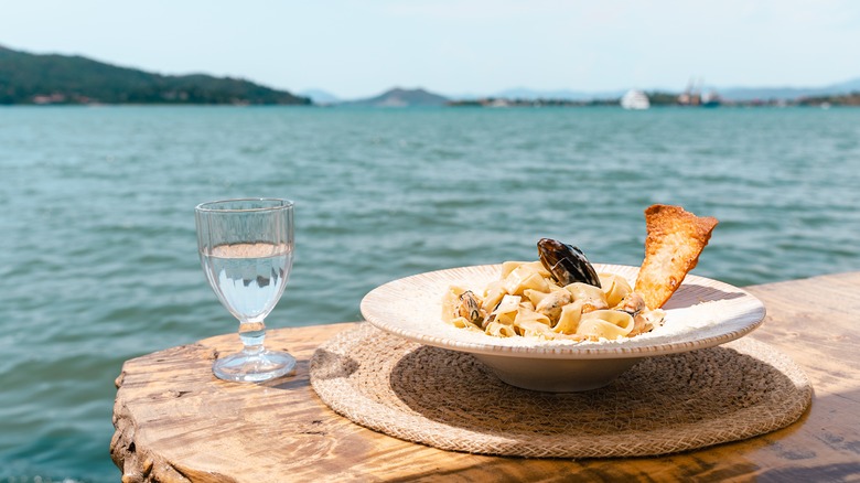 Seafood pasta with water view