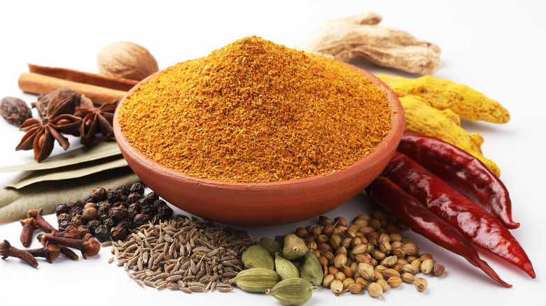 bowl of curry powder with other spices