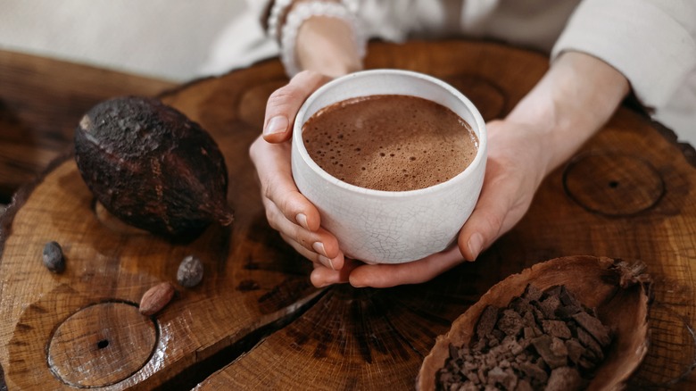Holding hot chocolate in hands 