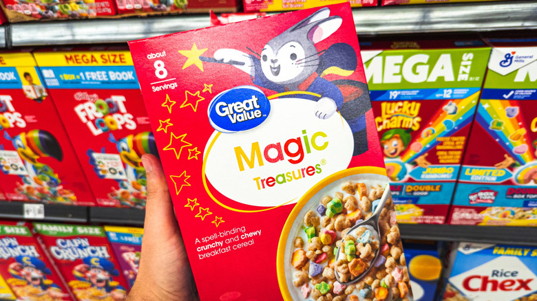 person holding Great Value brand cereal in Walmart store aisle