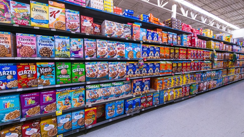 A whole cereal aisle at Walmart featuring dozens of different brands