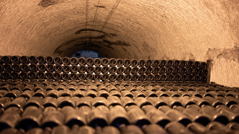 Bottles of Champagne aging underground