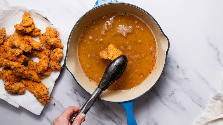 Frying chicken in oil