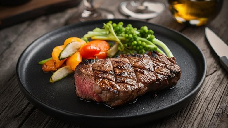 Grilled steak with vegetables on a plate