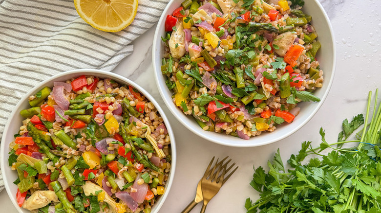 Two bowls of spring vegetable and herb salad