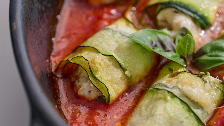 close up of a zucchini bundle in sauce