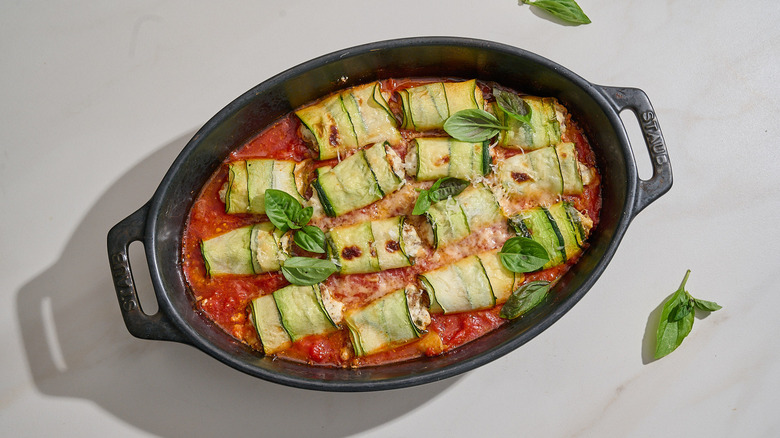 zucchini involtini with basil and cheese on top