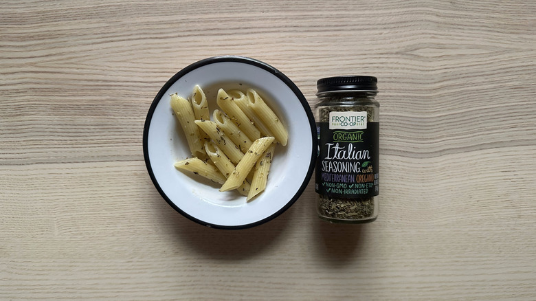 Frontier Co-op Organic Italian Seasoning with pasta in white bowl