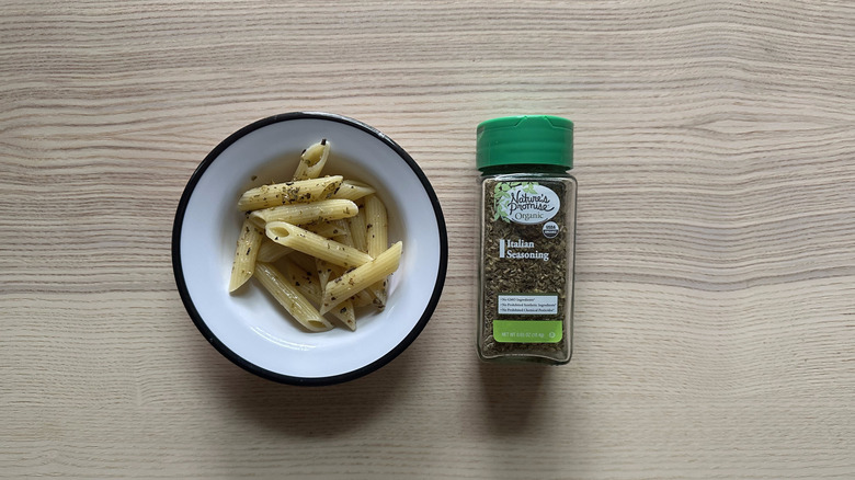 Nature's Promise Organic Italian Seasoning with pasta in white bowl