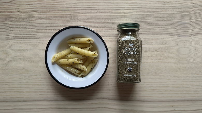 Simply Organic Italian Seasoning with pasta in white bowl