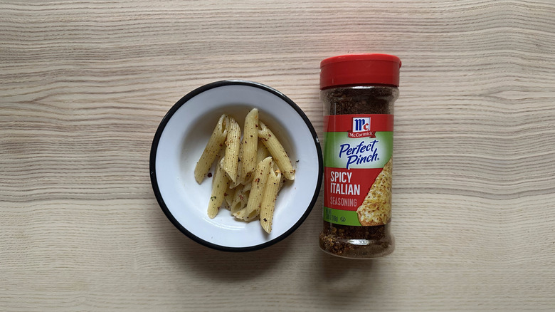 McCormick Perfect Pinch Spicy Italian Seasoning with pasta in white bowl