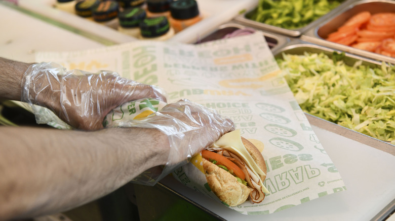 Subway worker making a sandwich