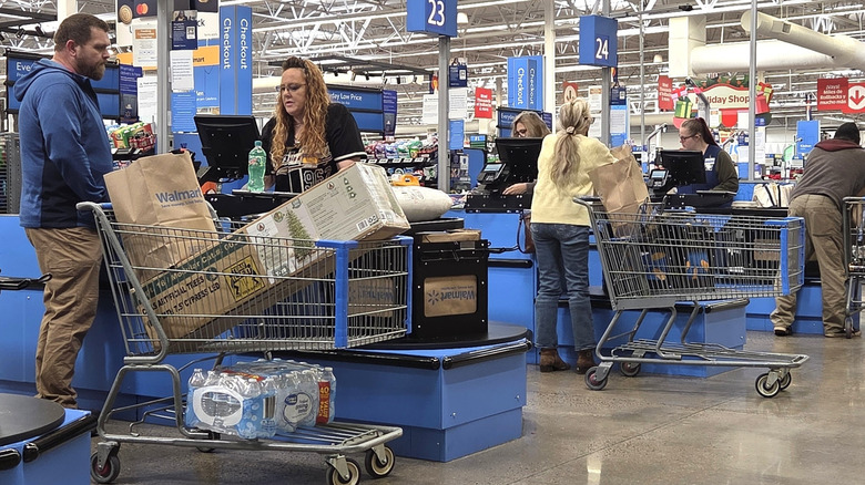 Shoppers checking out at the Walmart cash registers