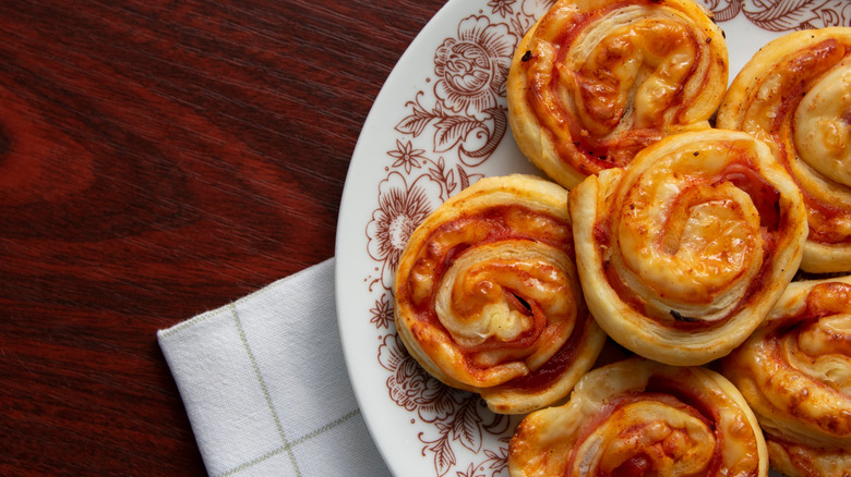 Leftover pizza pinwheels on plate