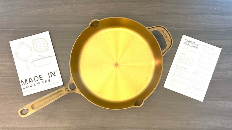 Made In seasoned cast iron 10" skillet with instruction booklet and cleaning instructions