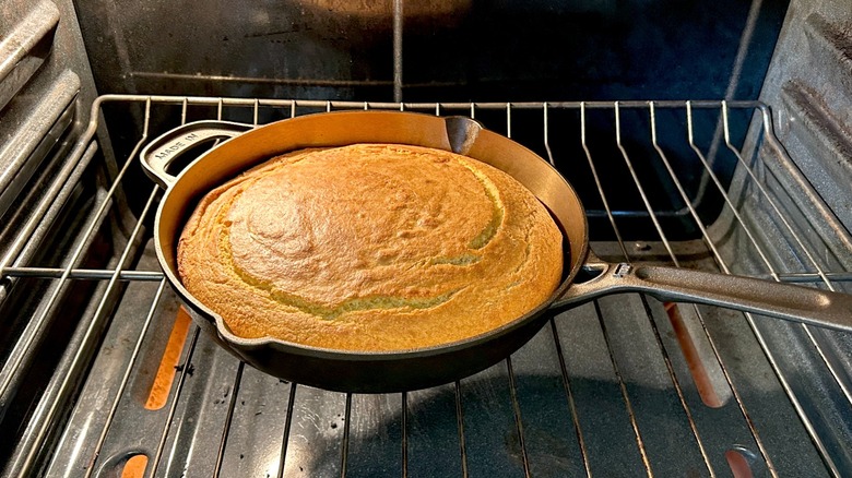 Freshly baked cornbread in Made In 10" seasoned cast iron skillet in the oven