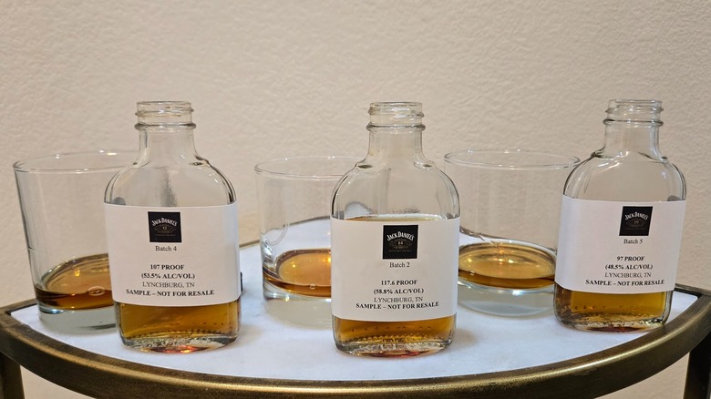 Bottles of Jack Daniels 10, 12, 14-year-old whiskies and glasses