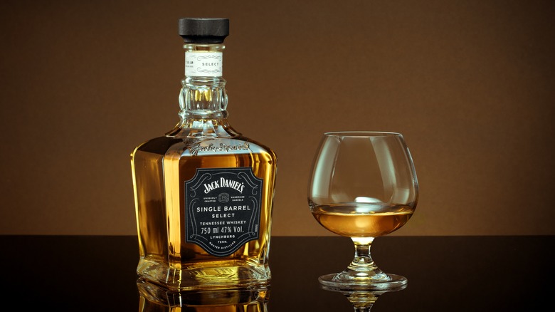 Bottle of Jack Daniel's with poured dram