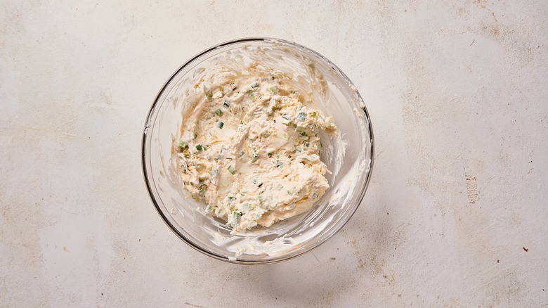 mixing ingredients in a large bowl