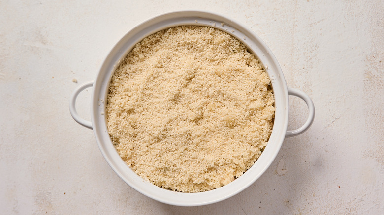 breadcrumbs spread onto jalapeno popper dip