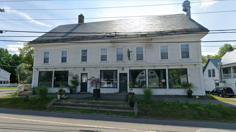 Large white building with many windows on sunny day