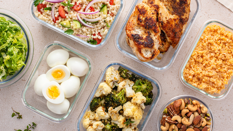 A meal prep spread with various dishes in glass containers