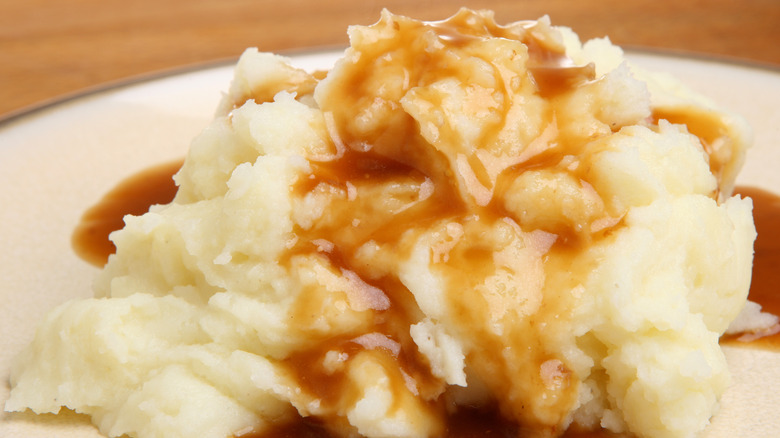 mashed potatoes topped with brown gravy