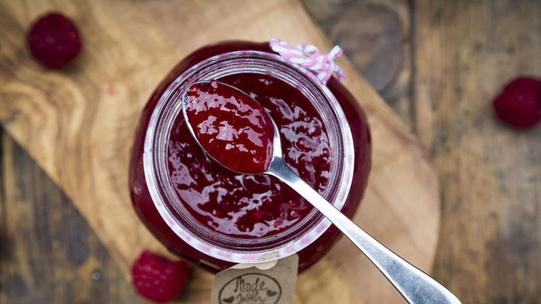 raspberry preserves on a wood board