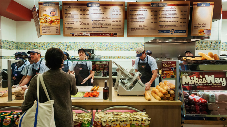 Jersey Mike's workers serving a customer