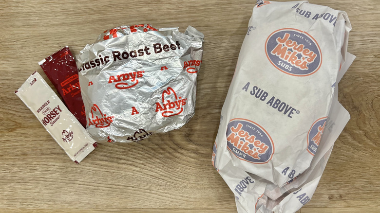 Arby's and Jersey Mike's sandwiches in wrapping