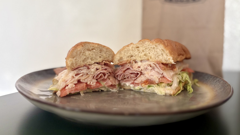 Plated club sub sandwich with turkey and tomato