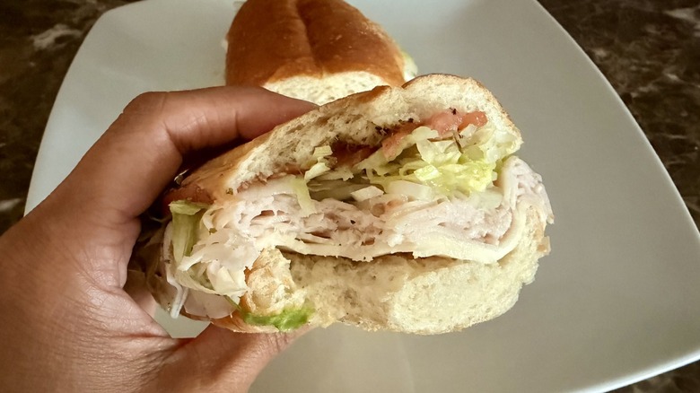 close up of Jersey Mike's Turkey and Provolone sub half with a bite taken out of it
