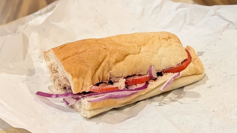 A tuna sub from Subway on white paper