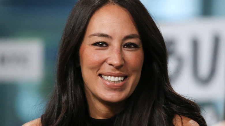 Joanna Gaines smiling with hair down