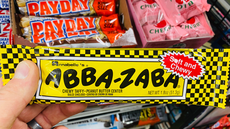 Hand holding an Abba-Zaba bar