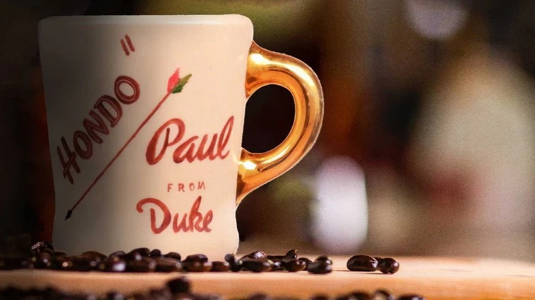 John Wayne gold handle mug with coffee beans