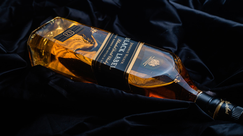 A Johnnie Walker Black Label bottle on its side.